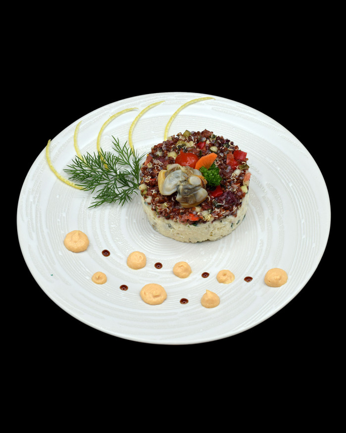 Effiloché d’églefin aux coques, quinoa rouge au gingembre et émulsion crustacés